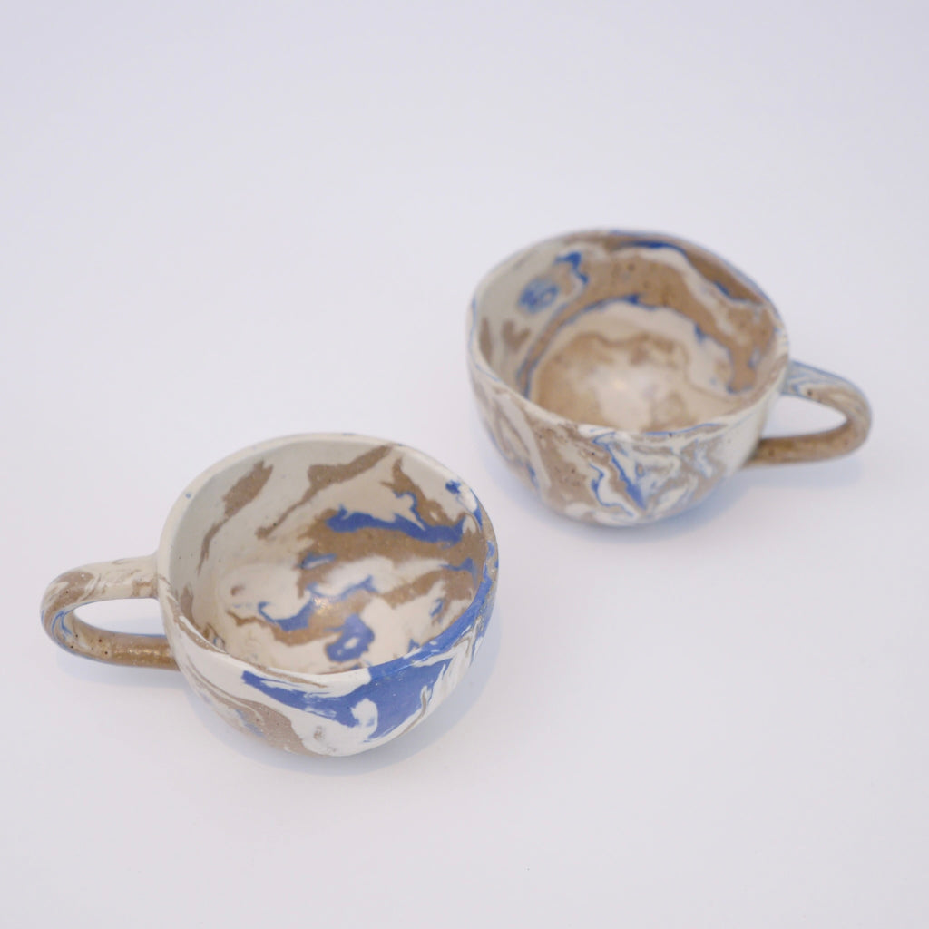 Set of two handmade marbled ceramic espresso cups with matte clear glaze