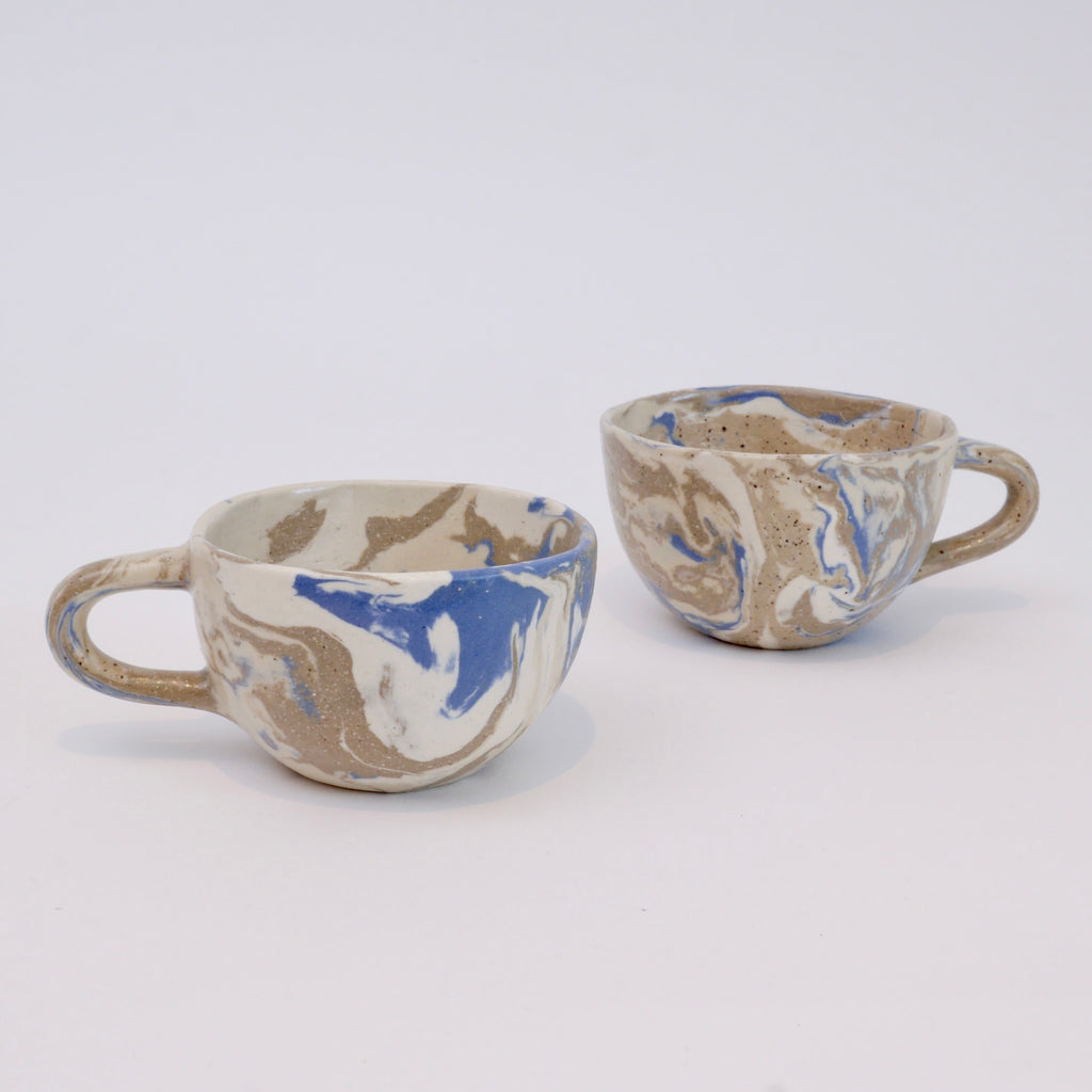 Set of two handmade marbled ceramic espresso cups with matte clear glaze