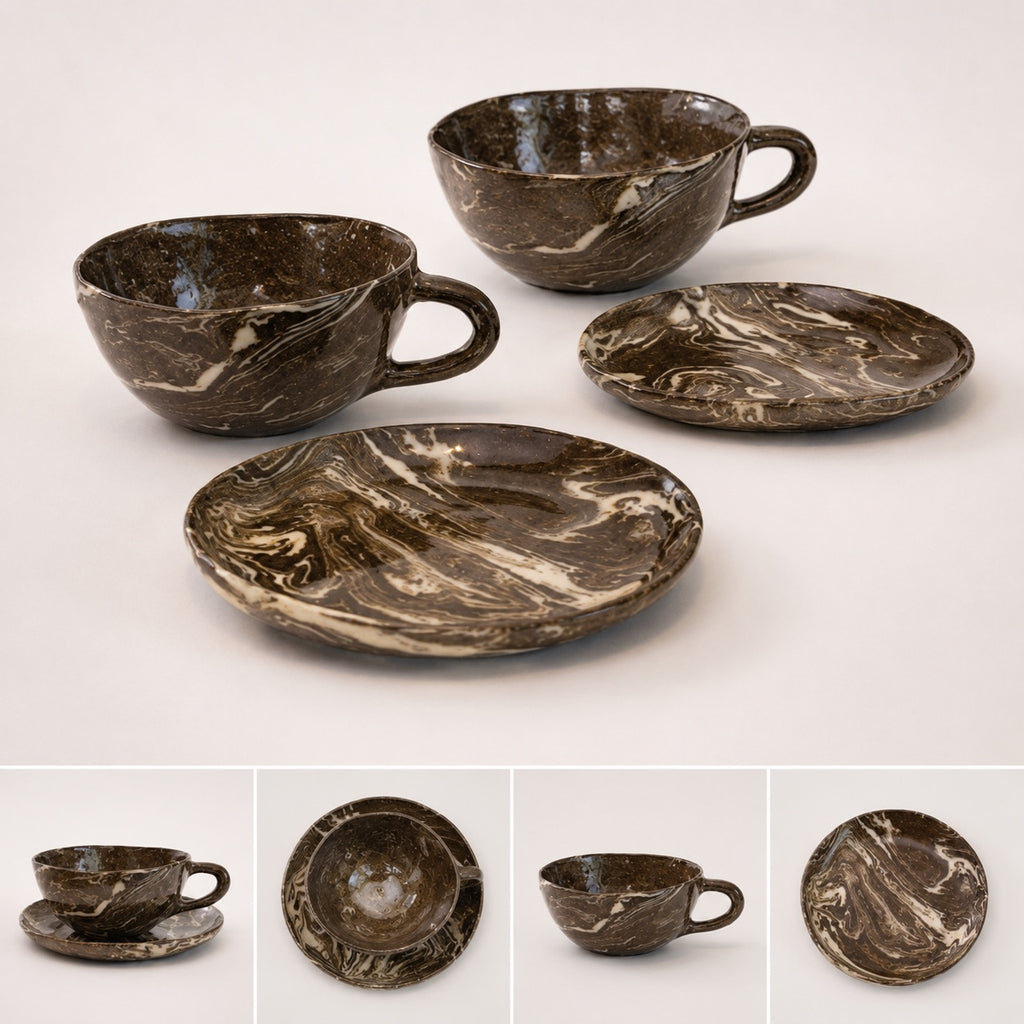 Set of marbled brown ceramic cups and saucers on a white background