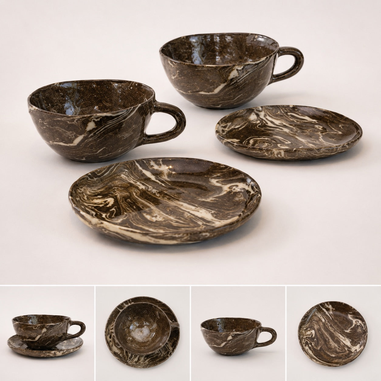 Set of marbled brown ceramic cups and saucers on a white background